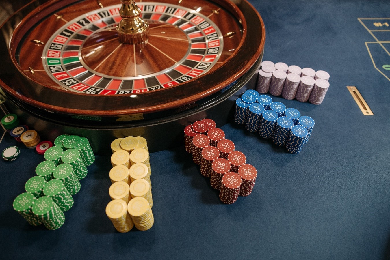 Photo by Pavel Danilyuk: https://www.pexels.com/photo/close-up-photo-of-stacked-poker-chips-beside-casino-roulette-7594188/